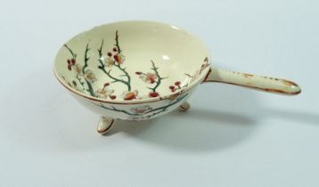 A 19th century Faience small dish with handle painted blossom by keller & guerin, 10cm diameter