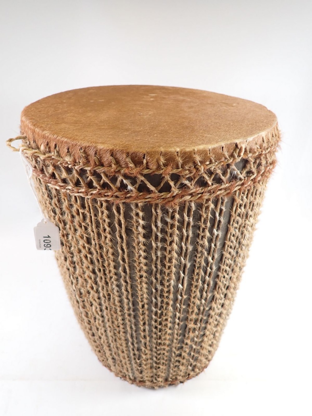 A tribal skin drum, 37cm tall