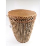 A tribal skin drum, 37cm tall