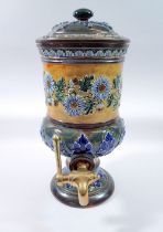 A Doulton Lambeth stoneware water filter with blue floral decoration, brass tap, 36cm tall