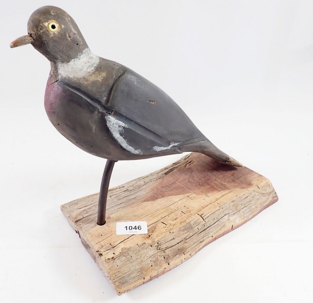 A mounted mid 20th century decoy pigeon with glass eyes, 28cm tall