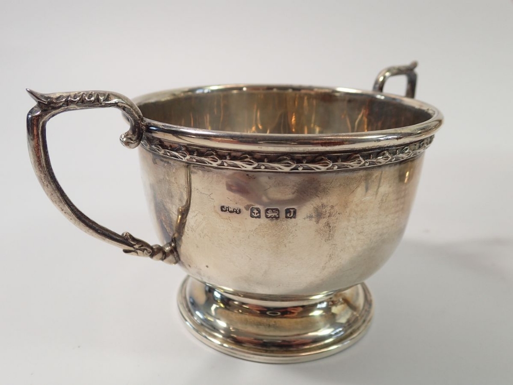 A silver tea service with leaf and berry border, Birmingham 1933 by James Walter Tiptaft and a - Image 2 of 3
