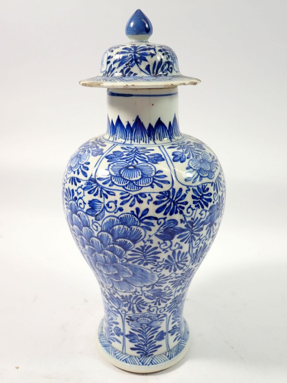 A Chinese 18th century blue and white baluster vase and cover with all over floral decoration, 28cm - Image 3 of 7
