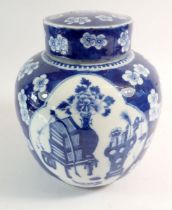 A late Qing Dynasty Chinese blue and white ginger jar with prusnus blossom and panelled