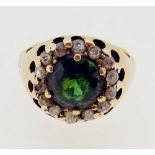 An 18 carat gold diamond and emerald cluster ring, size M, 7.2g