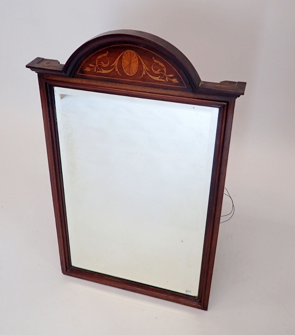 An Edwardian mahogany arch top mirror with satinwood paterae and foliage inlay, 46 x 75cm
