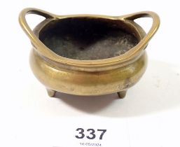 A Chinese miniature bronze censer, seal mark to base, 7.5cm wide including handles