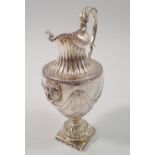 A fine silver cream jug by Robert Hennell with Neo-claissical swags, leaf and lion mask