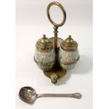 A Victorian painted glass and brass three piece cruet set on stand