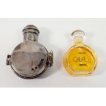 A silver plated Cavale perfume bottle and perfume within