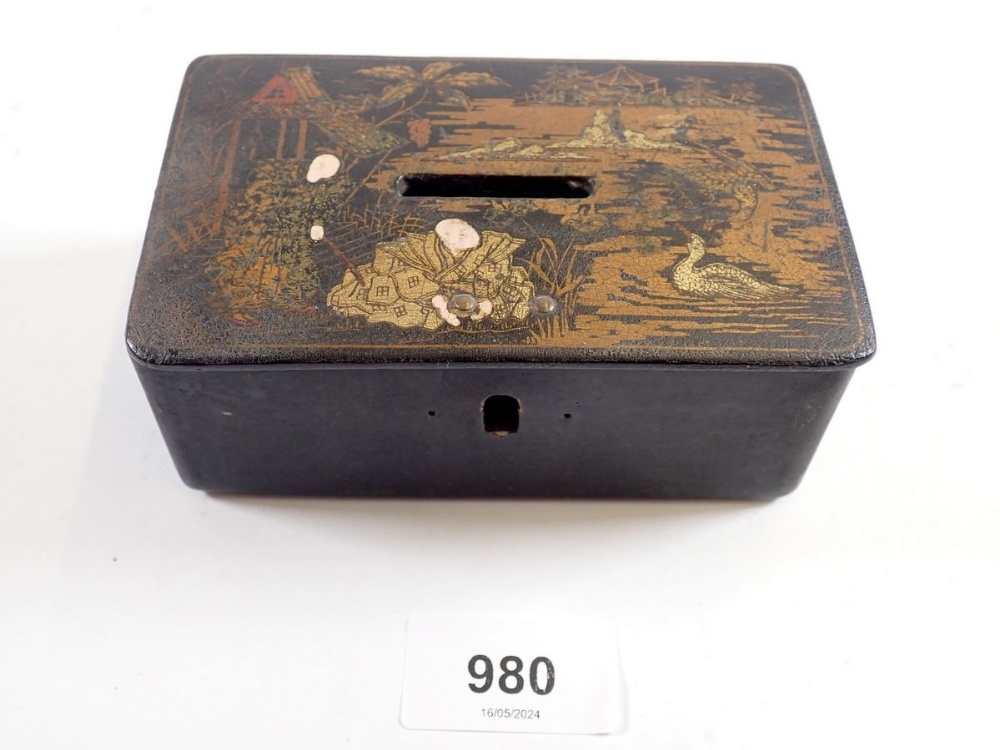 A Japanese lacquer money box decorated figures and landscape, 12.5cm wide