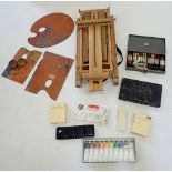 A Winsor and Newton wooden travel easel together with various Winsor and Newton and other oils,