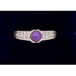 A 14k white and yellow gold ring set amethyst on diamond set shoulders, size L to M, 3.6g
