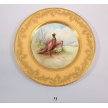 A Minton plate painted pheasants by A Holland within yellow and gilt border, 27cm diameter