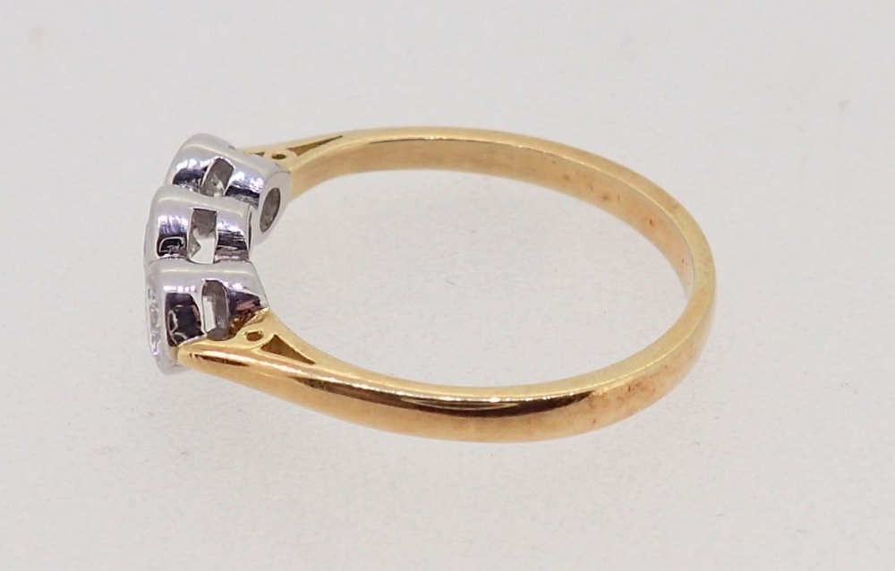 An 18ct white and yellow gold ring collet set three diamonds, size K, 2.2g - Image 3 of 4