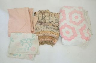 A pink and white patchwork quilt, a hand stitched pink Durham quilt, a machine made tasseled throw