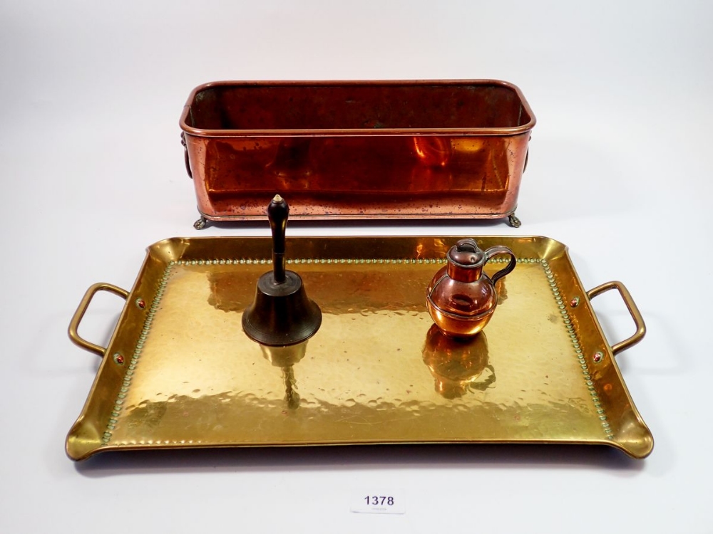 A copper plant trough 38cm long, a brass hammered tray, a miniature gurnsey and a brass bell