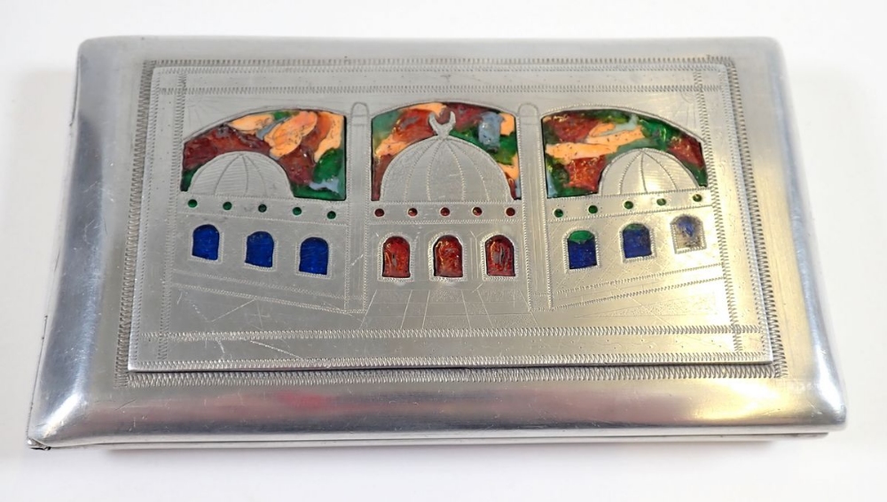 An early 20th century white metal and enamel cigarette case depicting India, Egypt and Africa with