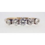 An 18ct gold nd platinum set five stone diamond ring, size I to J, 2g