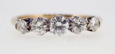 An 18ct gold nd platinum set five stone diamond ring, size I to J, 2g