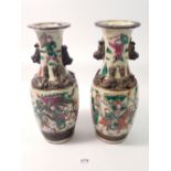 A pair of Japanese crackle glaze vases decorated warriors, 25cm tall