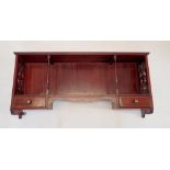 An Edwardian mahogany display shelf with pierced sides and two small drawers to apron, 84 x 35cm
