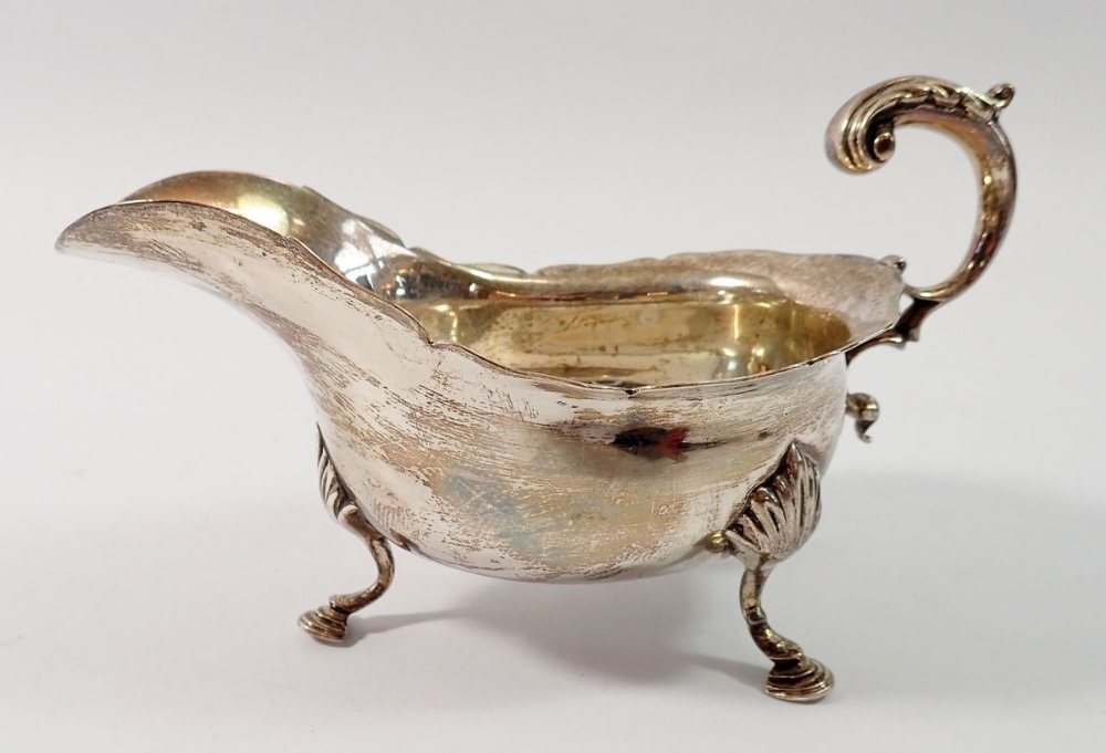 A silver sauce boat on shell and hoof feet, Sheffield 1902, Fordham & Faulkner, 268g