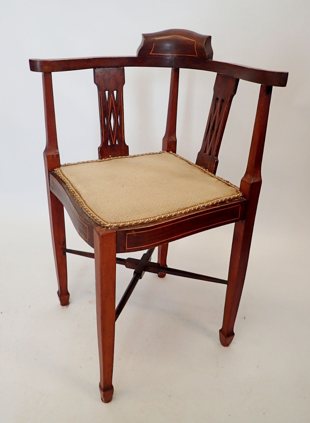 An Edwardian mahogany and satinwood inlaid corner chair