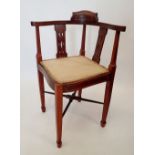An Edwardian mahogany and satinwood inlaid corner chair