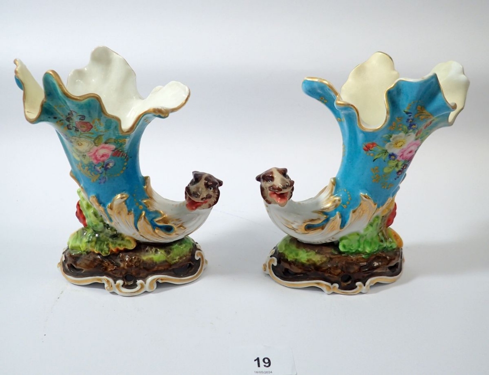 A pair of 19th century cornucopia vases painted flowers plus a small blue and white onion pattern