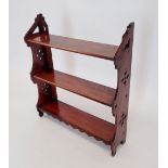 A Victorian mahogany set of wall shelves with pierced decoration, 56cm wide