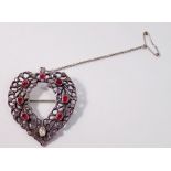 A white metal heart form pendant/locket set rubies and diamonds (largest stone not a diamond) 15g,