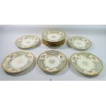 A set of eleven Victorian Coalport dessert plates painted flowers with grey and gilt reserves,