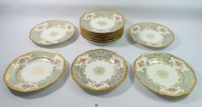 A set of eleven Victorian Coalport dessert plates painted flowers with grey and gilt reserves,