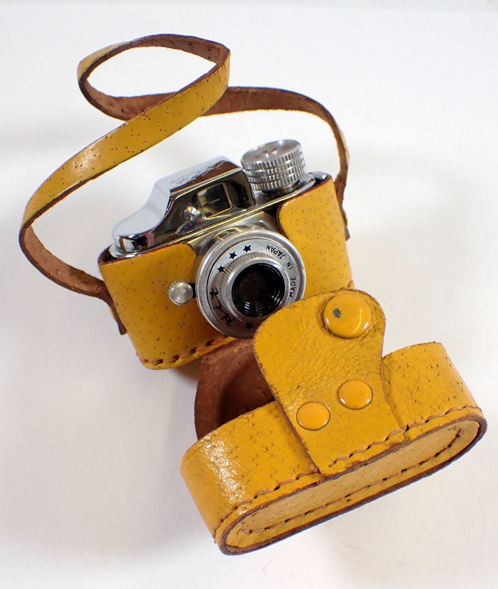 A Japanese miniature Hit camera in yellow case