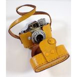 A Japanese miniature Hit camera in yellow case