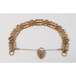 9ct gold gatelink bracelet with heart padlock, 13.8g
