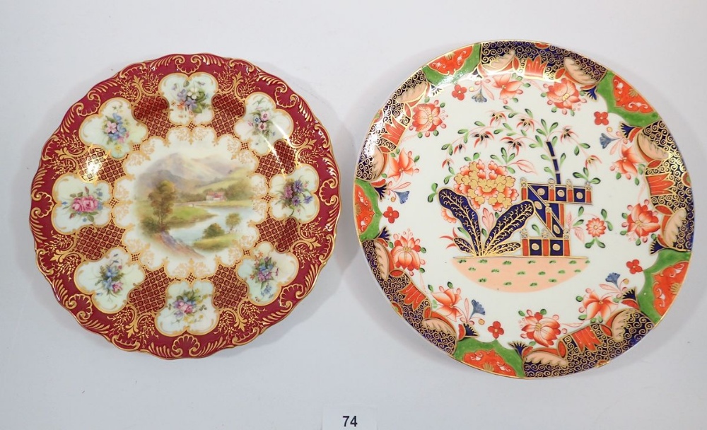 A 19th century Worcester plate painted landscape within floral border 22cm and an early 19th century