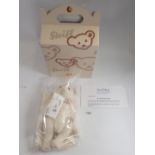 A Steiff limited edition white Alpaca bear Jill with box and certificate, sealed in bag
