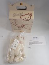 A Steiff limited edition white Alpaca bear Jill with box and certificate, sealed in bag