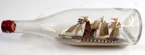 A Victorian model steam ship in a glass bottle, 28cm wide