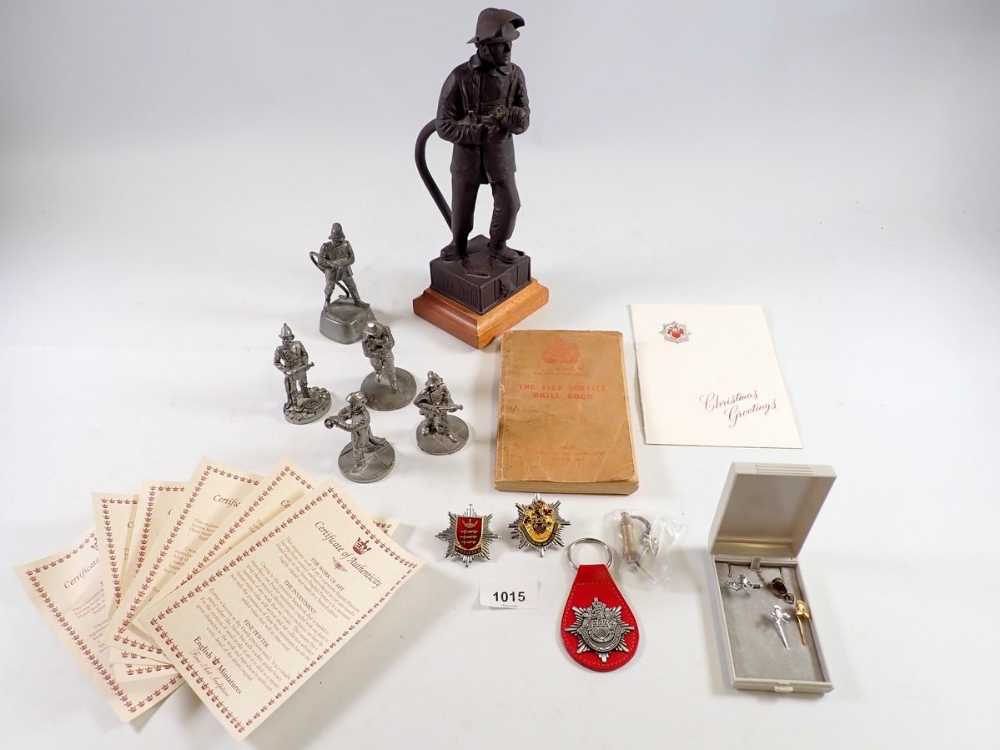 A group of English Miniatures fireman related figures, a figure of a fireman by R & V Green, 26cm