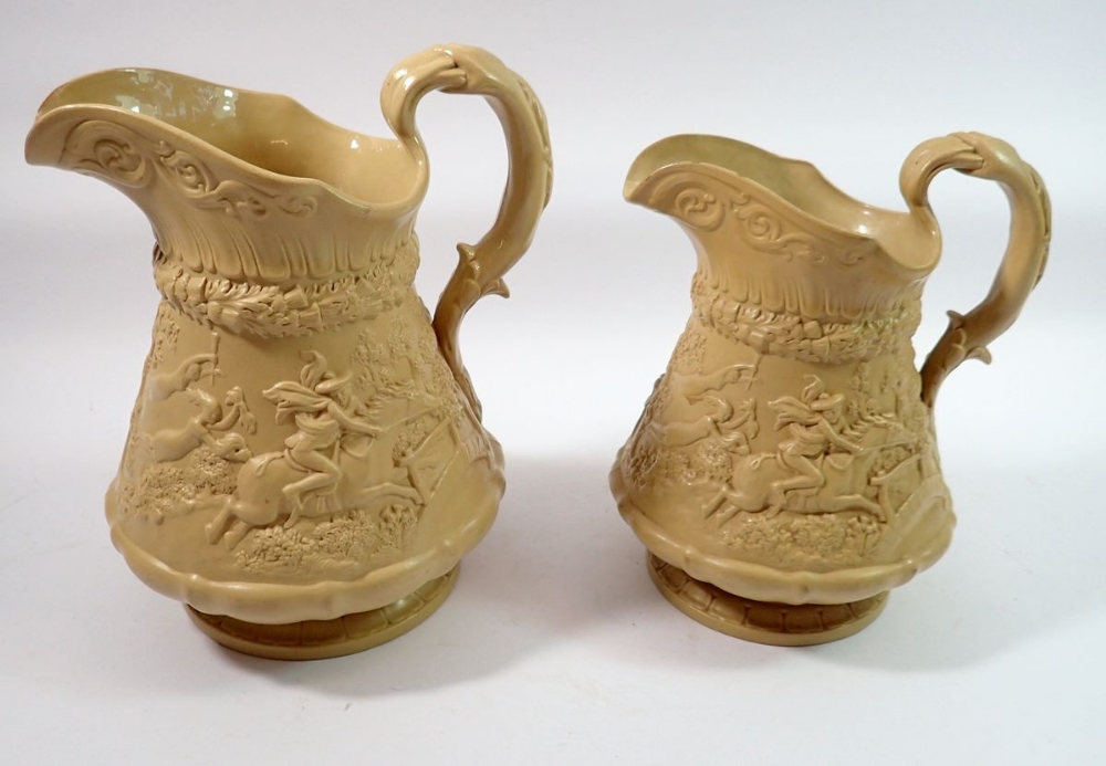Two Ridgeways stoneware press moulded jugs decorated Tom-O-Shanter, largest 24cm