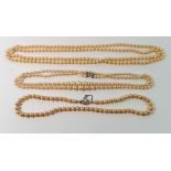 Three vintage pearl necklaces, two with decorative clasps