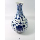 A Chinese blue and white baluster vase decorated peony and trailing leaves, 34cm tall