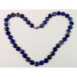 A lapis lazuli bead necklace with silver clasp