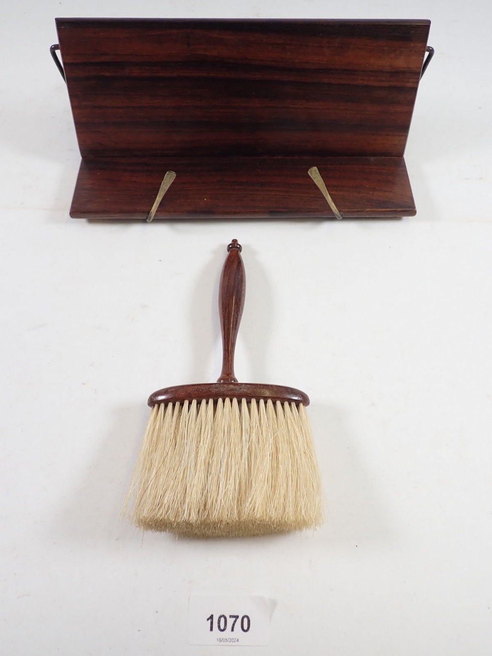 A rosewood bookrest and a rosewood hat brush