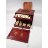 A bone and bamboo Mahjong set in case (back of case a/f) and four lacquer counter stands