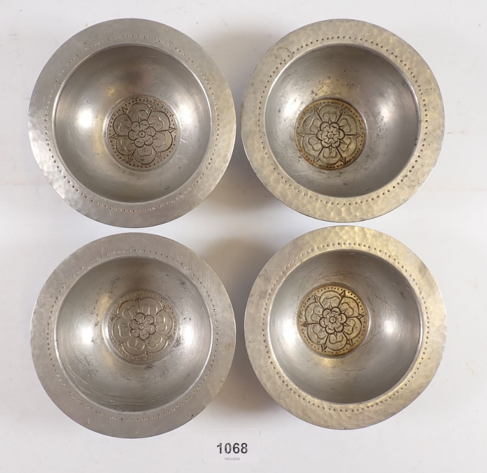 A set of four unusual Tudric pewter small dishes with Tudor Rose to base, made for Liberty, No