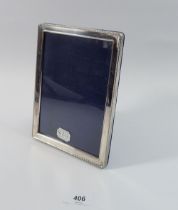 A rectangular silver photograph frame, Sheffield 1991, by John bull Ltd, internal 18 x 13cm